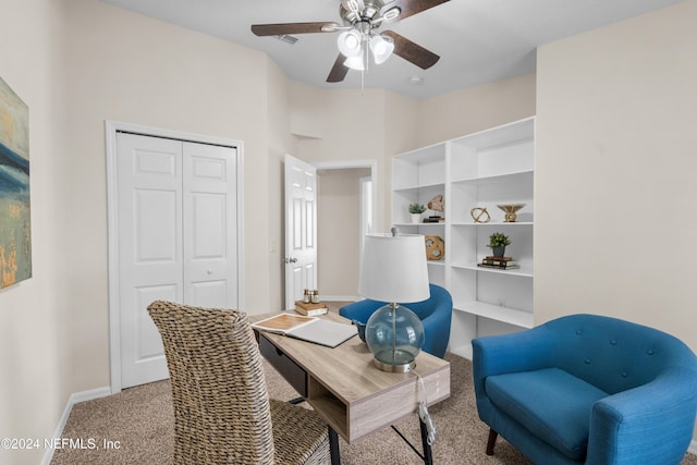 carpeted home office with ceiling fan