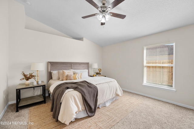 bedroom featuring light colored carpet, ceiling fan, and lofted ceiling