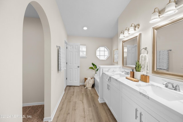 bathroom with vanity and hardwood / wood-style flooring