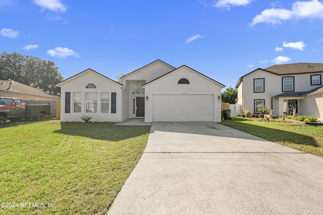 view of front facade featuring a front lawn and a garage