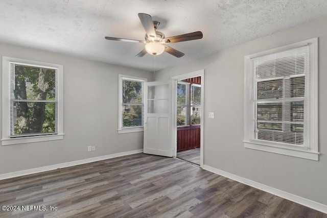 spare room featuring ceiling fan, a textured ceiling, and hardwood / wood-style flooring