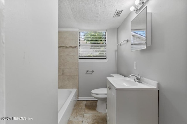 bathroom featuring tile patterned flooring, vanity, a textured ceiling, and toilet