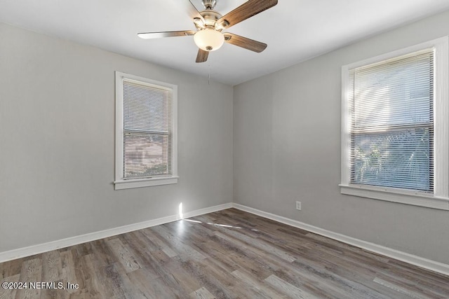 spare room featuring hardwood / wood-style flooring and ceiling fan