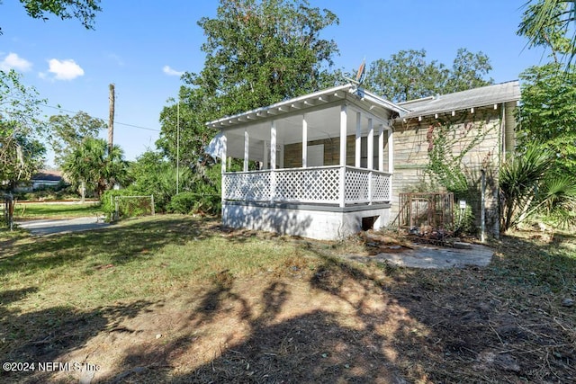 view of property exterior with a yard