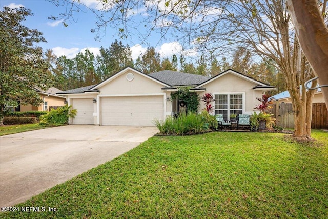 ranch-style home with a garage and a front lawn