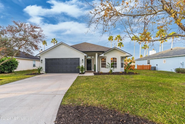 ranch-style house with central AC, a front yard, and a garage