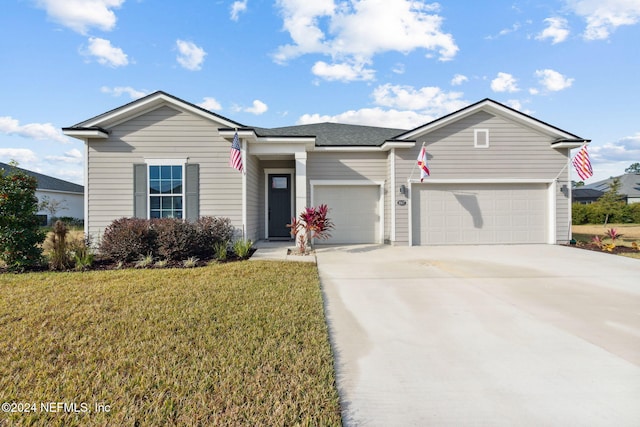 ranch-style home with a front lawn and a garage