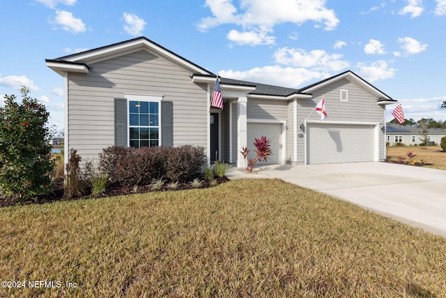 ranch-style home with a garage and a front lawn