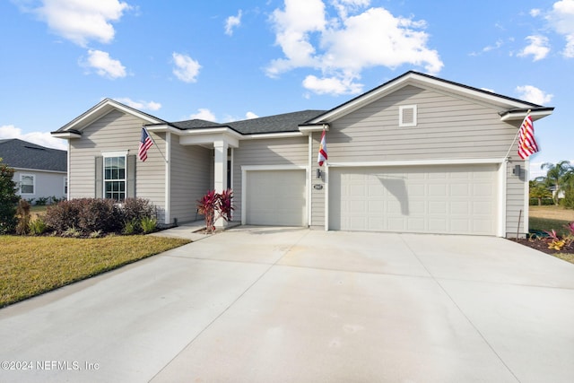 ranch-style home featuring a garage