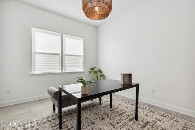 office with light wood-type flooring