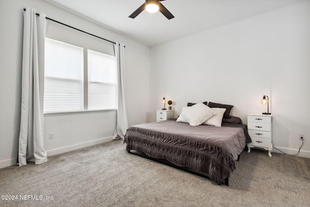 bedroom with light colored carpet and ceiling fan