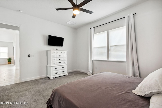 carpeted bedroom with ceiling fan