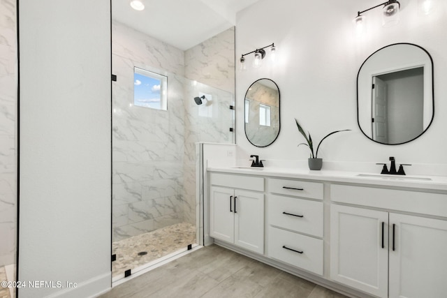 bathroom featuring vanity and a tile shower