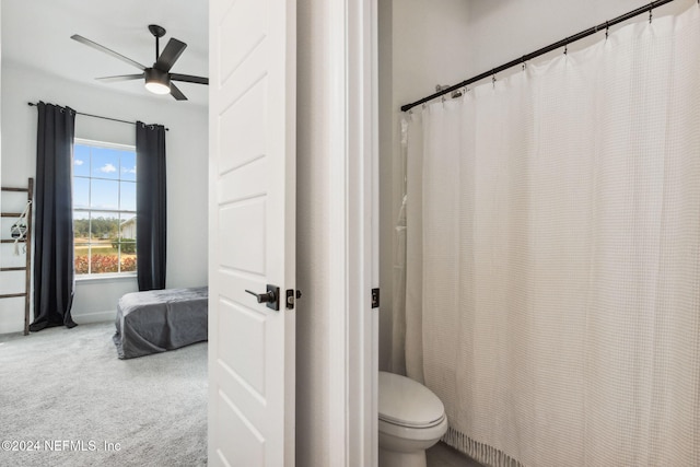 bathroom with ceiling fan and toilet