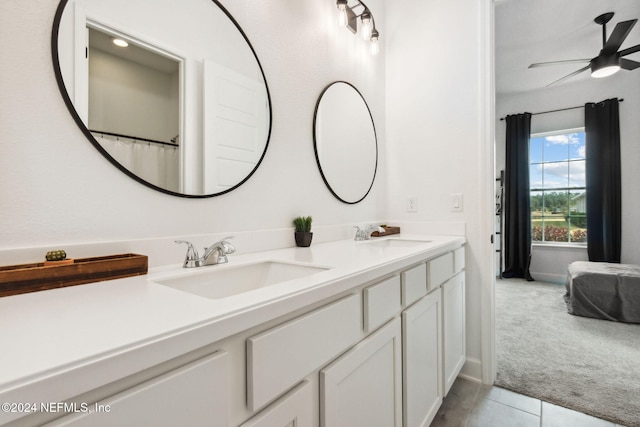 bathroom featuring ceiling fan, tile patterned flooring, and vanity