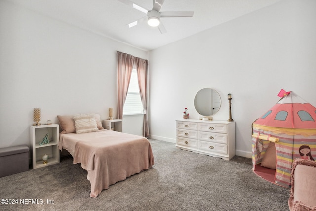 bedroom with ceiling fan and dark carpet