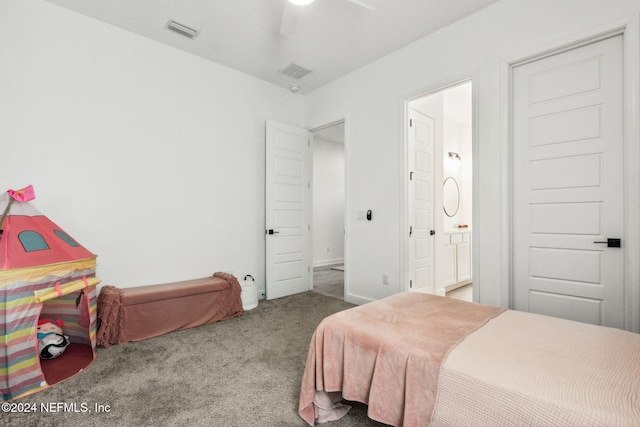 carpeted bedroom featuring connected bathroom and ceiling fan