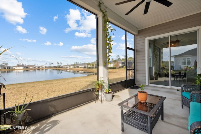 sunroom with a water view and plenty of natural light