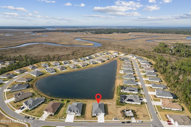 drone / aerial view featuring a water view