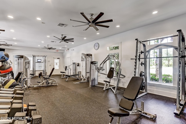 workout area featuring ceiling fan and plenty of natural light