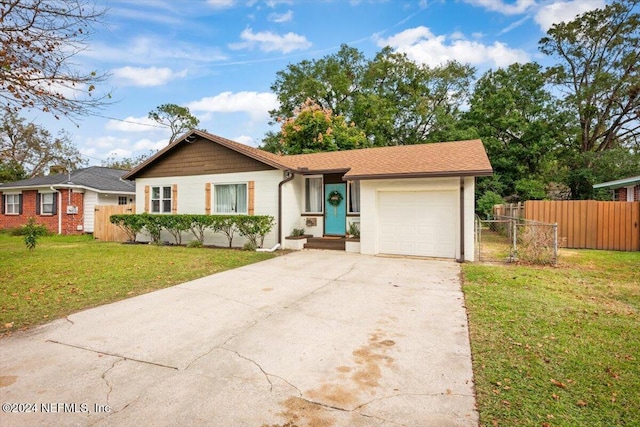 ranch-style home with a front yard and a garage