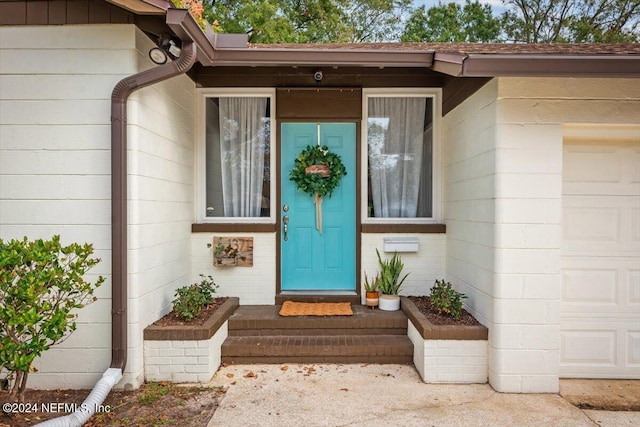 property entrance featuring a garage