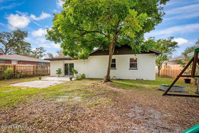 back of property featuring a patio area