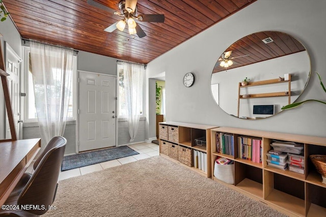 tiled foyer entrance featuring ceiling fan and wood ceiling