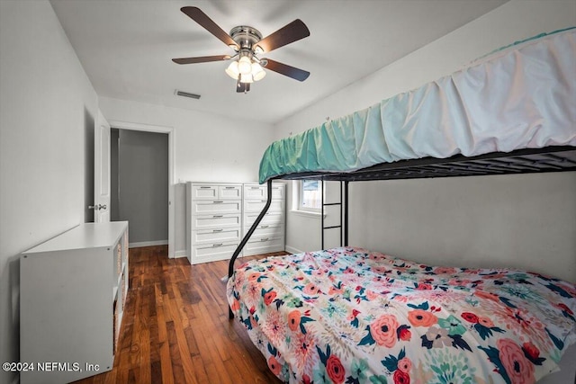 bedroom featuring ceiling fan and dark wood-type flooring