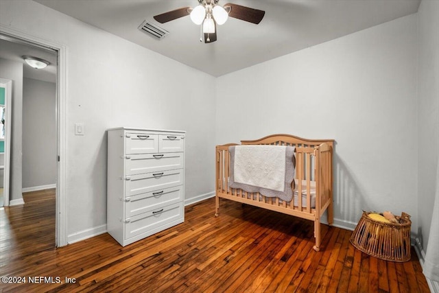 bedroom featuring hardwood / wood-style floors and ceiling fan