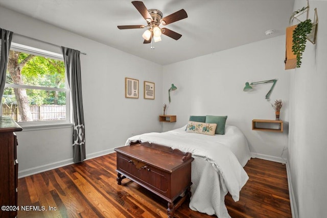 bedroom with ceiling fan and dark wood-type flooring