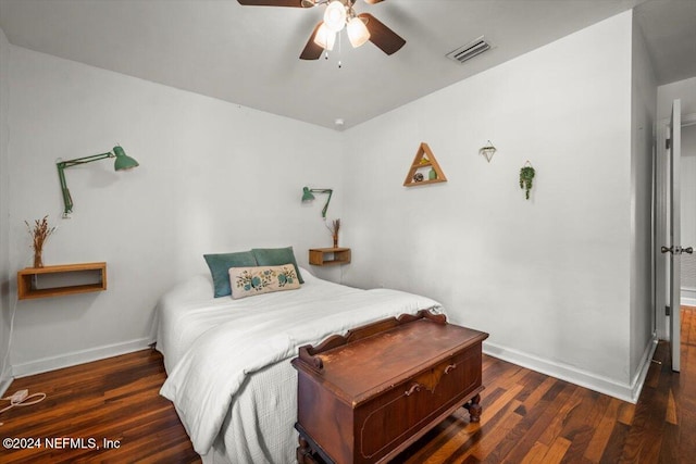 bedroom featuring ceiling fan and dark wood-type flooring