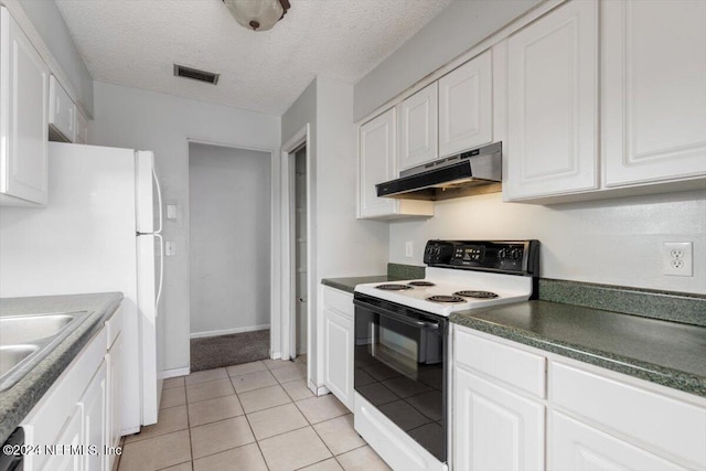 kitchen with white cabinets, white appliances, and a textured ceiling