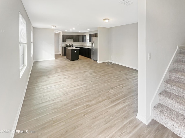 unfurnished living room featuring light hardwood / wood-style floors