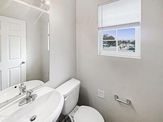 bathroom featuring sink and toilet