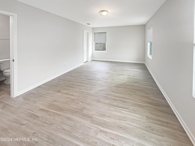 unfurnished room with light hardwood / wood-style flooring