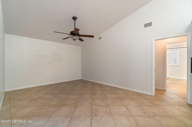 unfurnished room with light tile patterned floors, high vaulted ceiling, and ceiling fan