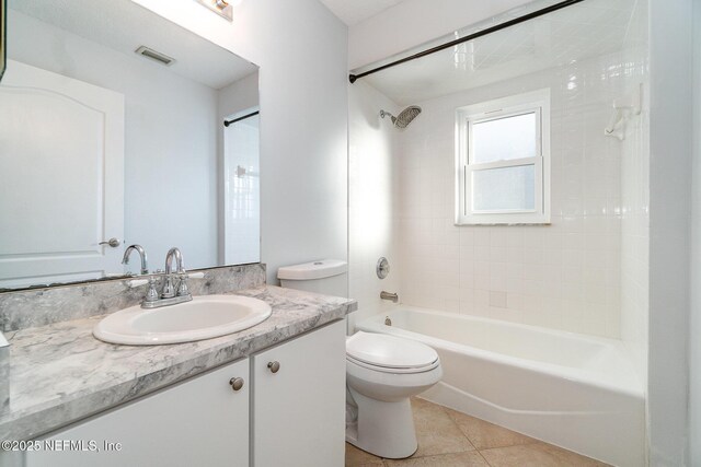 full bathroom with tile patterned floors, vanity, toilet, and tub / shower combination