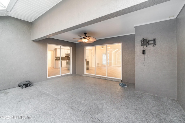 view of patio / terrace featuring ceiling fan