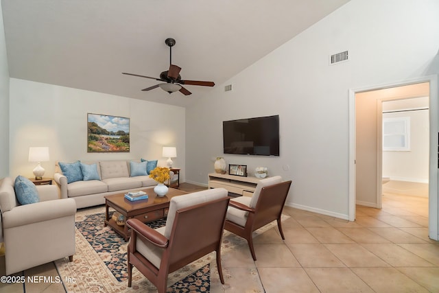 living room featuring ceiling fan, light tile patterned flooring, and high vaulted ceiling