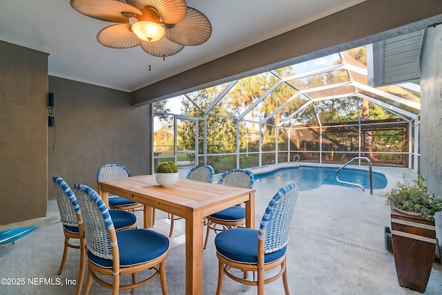 view of pool featuring a lanai, ceiling fan, and a patio area