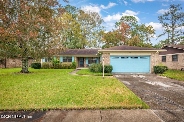 single story home featuring a garage and a front yard