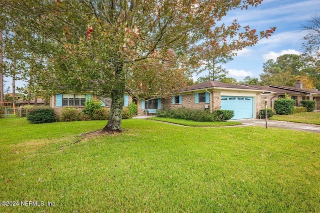 view of front of property with a garage and a front lawn