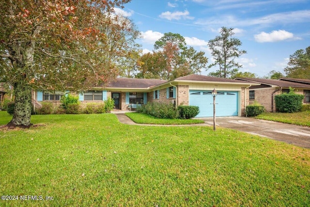 single story home featuring a front lawn and a garage