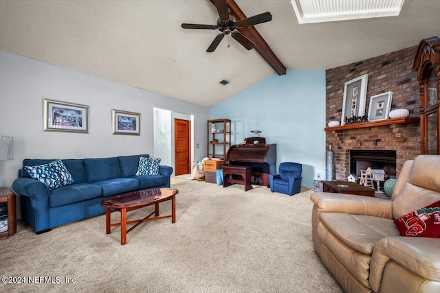 carpeted living room featuring vaulted ceiling with beams, ceiling fan, a textured ceiling, and a brick fireplace