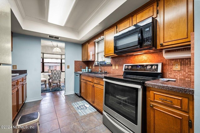 kitchen featuring backsplash, light tile patterned floors, stainless steel appliances, and ornamental molding