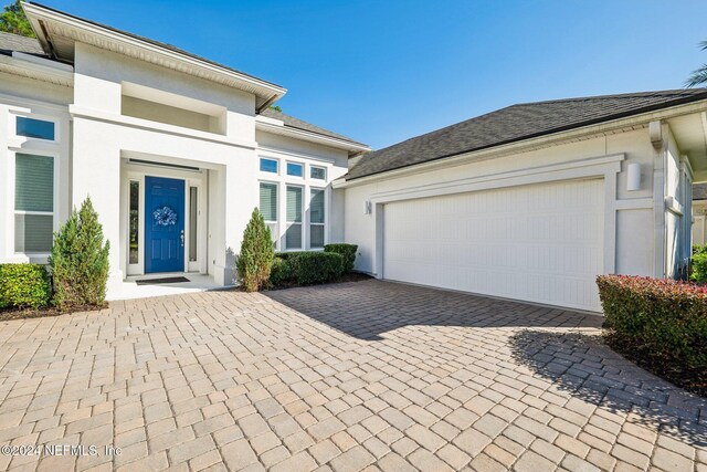 view of front of property featuring a garage