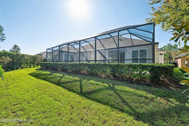 view of yard with a lanai