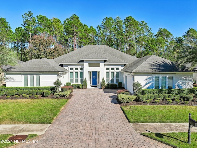 view of front of property with a front lawn