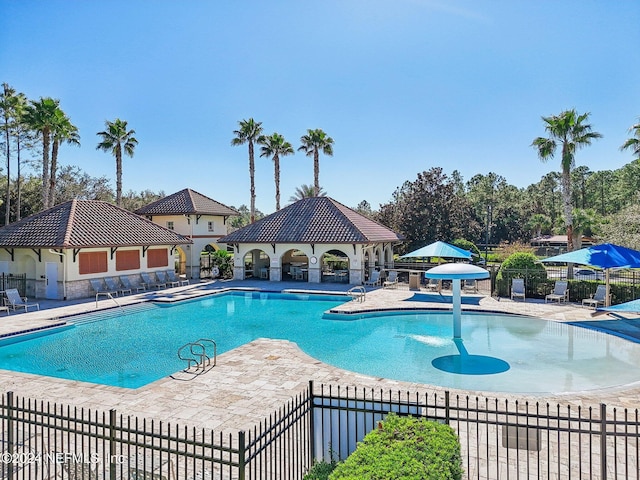 view of swimming pool featuring a gazebo and a patio